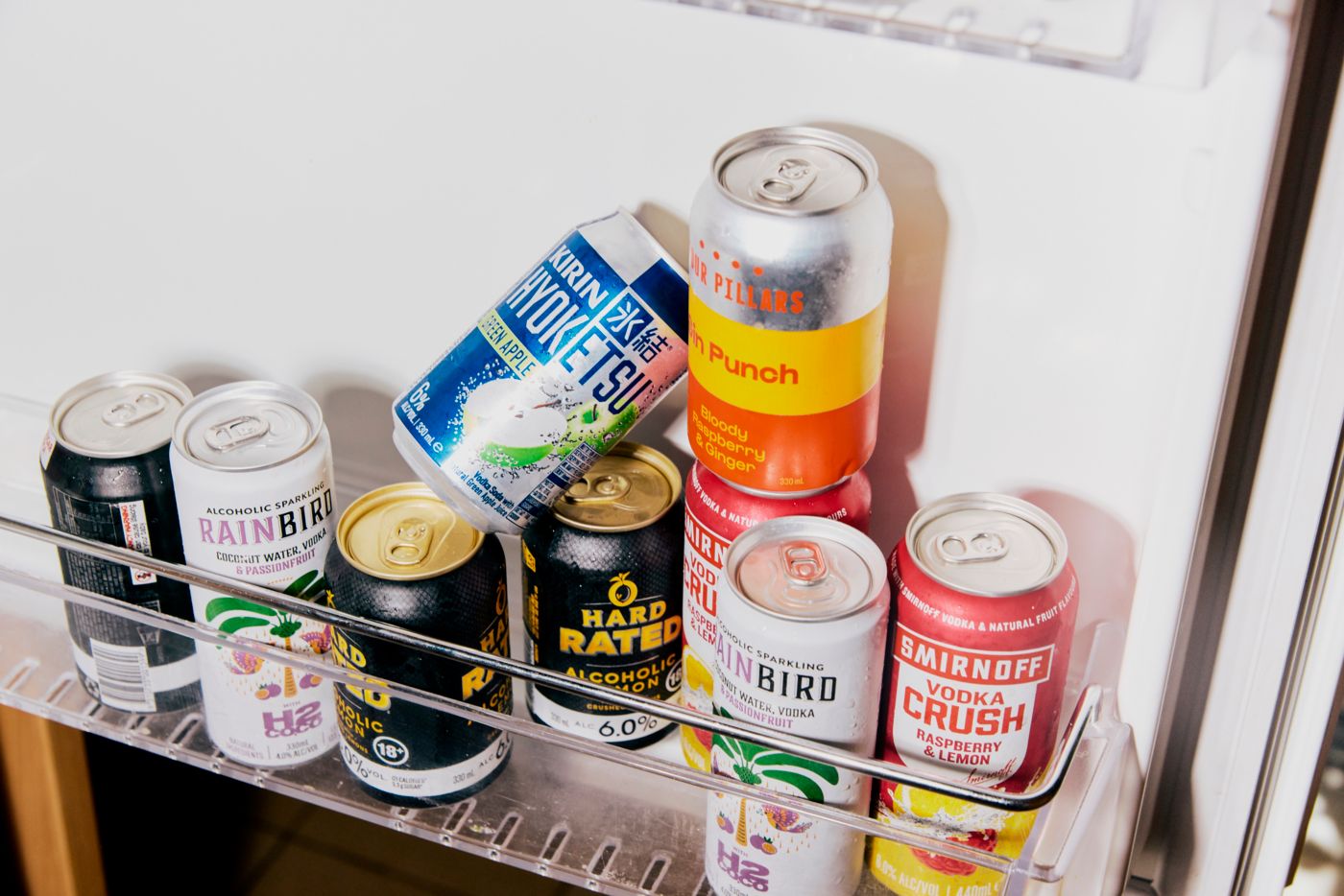 A fridge door holding a range of premix drinks