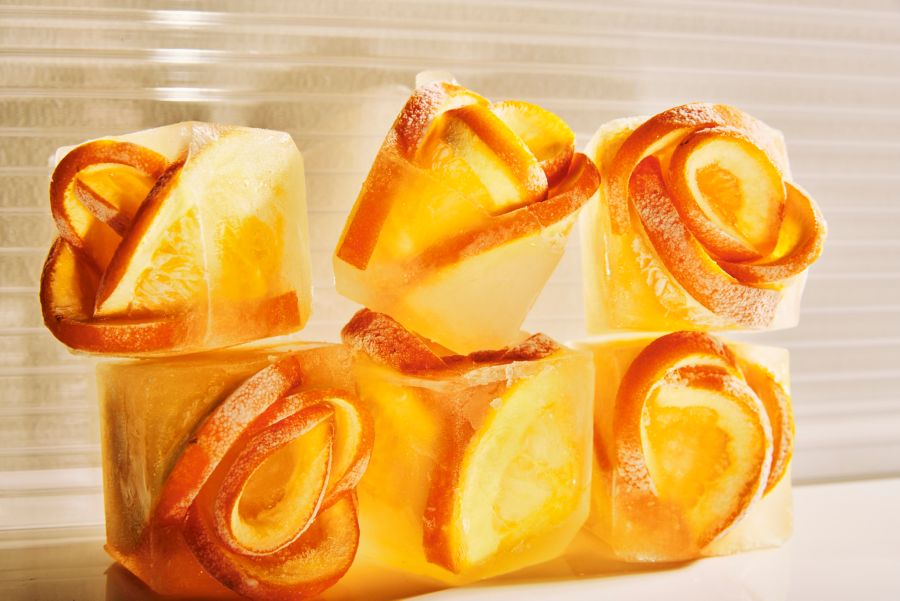 Orange slices frozen in ice cubes