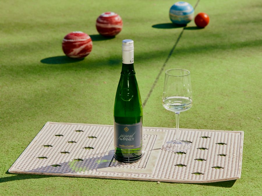 A bottle of Moulin de Gassac Picpoul De Pinet with a glass alongside it 