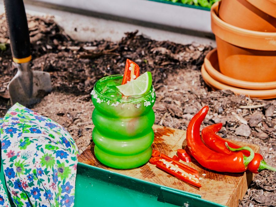 A Cocktail in the garden garnished with fresh chilli