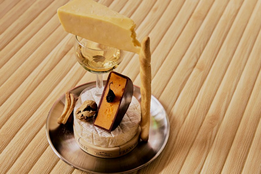 Cheese and accompaniments piled up on a plate