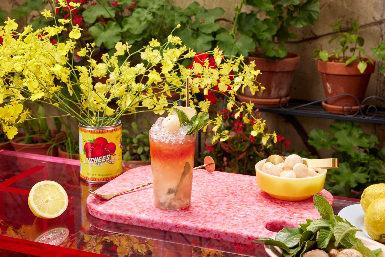 Lychee Soju Mojito cocktail on an outdoor table