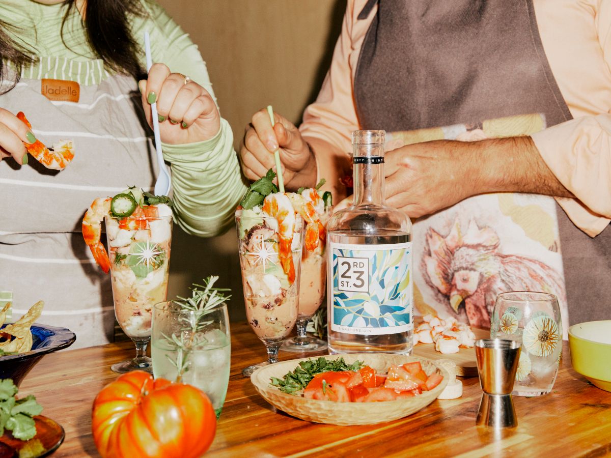 Lara and Pedro making entree prawn dish