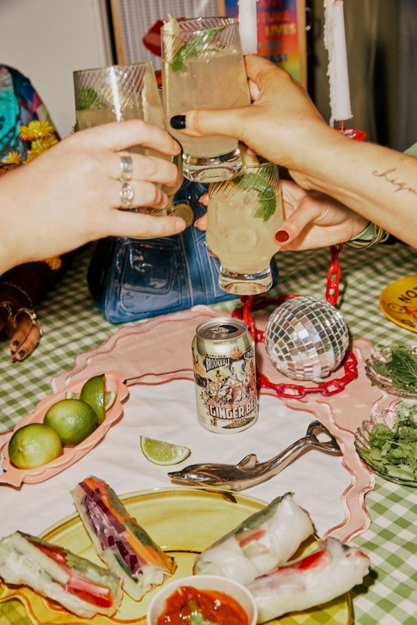 Friends toasting with their moscow mules at the dining table