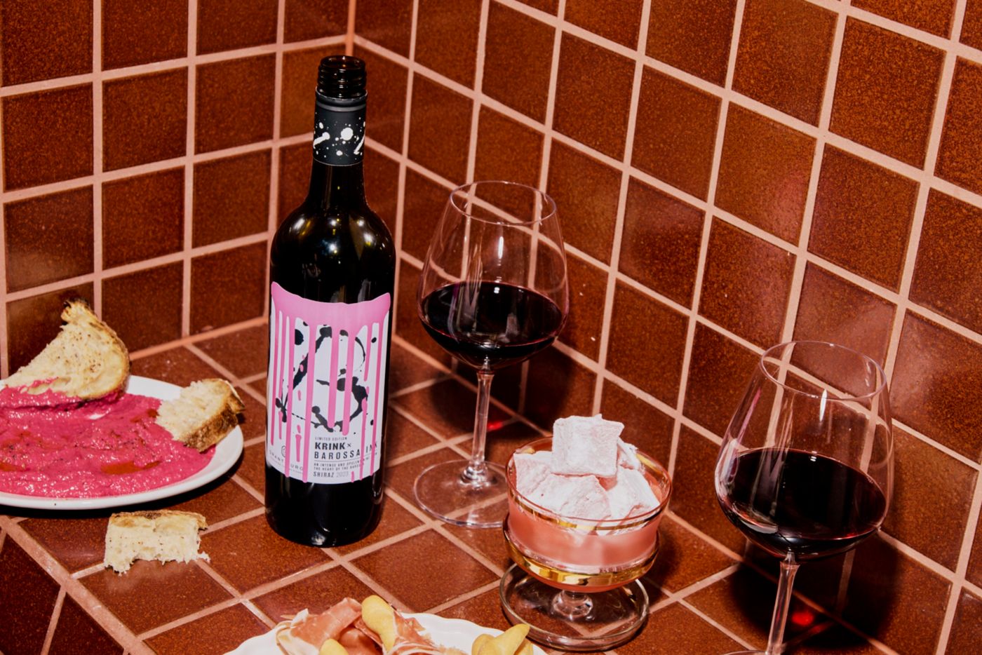 The new Grant Burge KRINK X Barossa Ink Limited Edition Shiraz with food and glasses