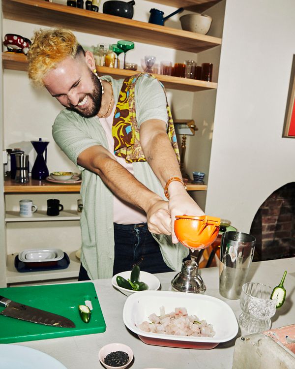 Conor Curran squeezing citrus over his kingfish ceviche
