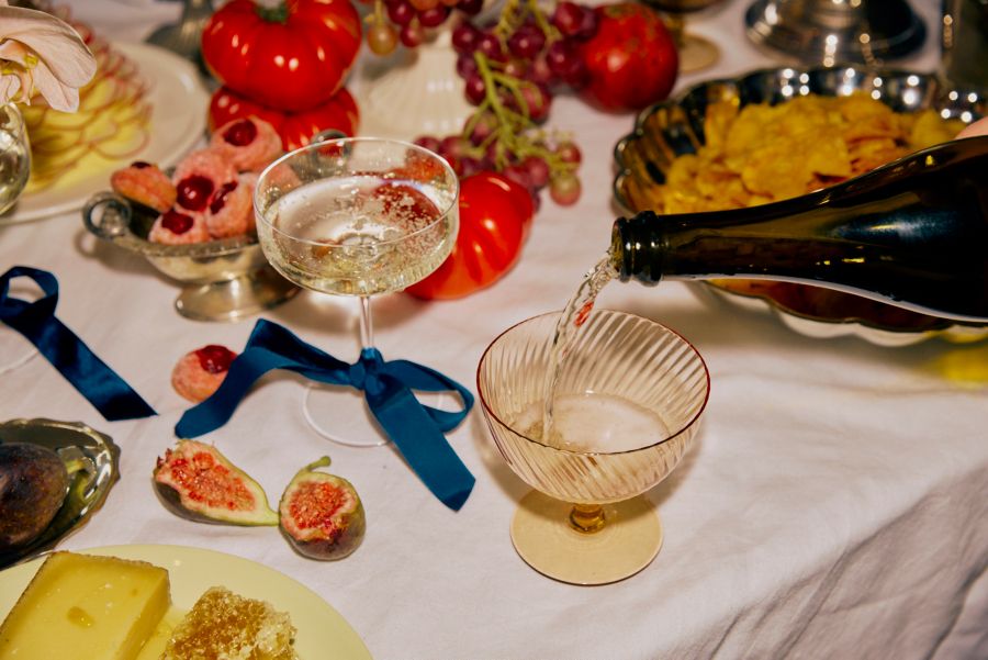 Pouring wines to toast the couple at an engagement party