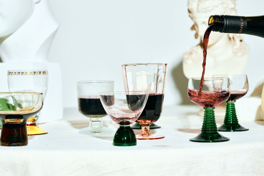 Glasses of red wine on table
