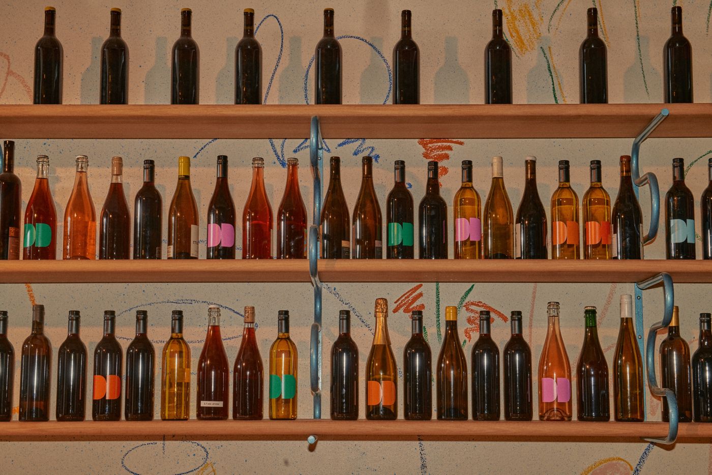 Shelves of wine bottles all lined up