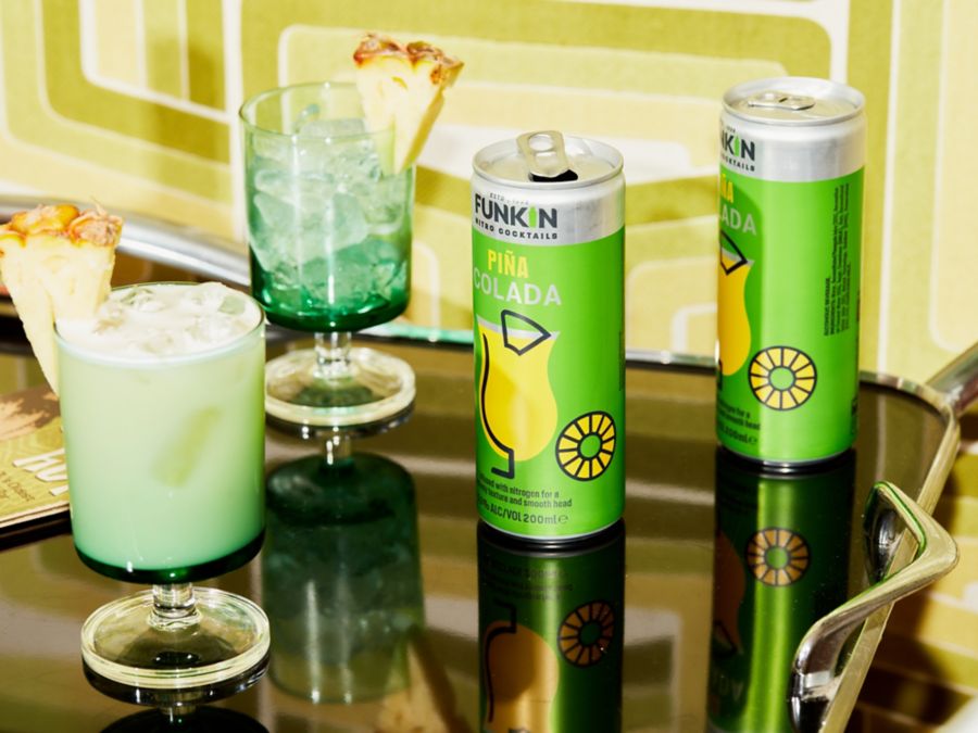 Funkin Pina Colada cans on a bar cart