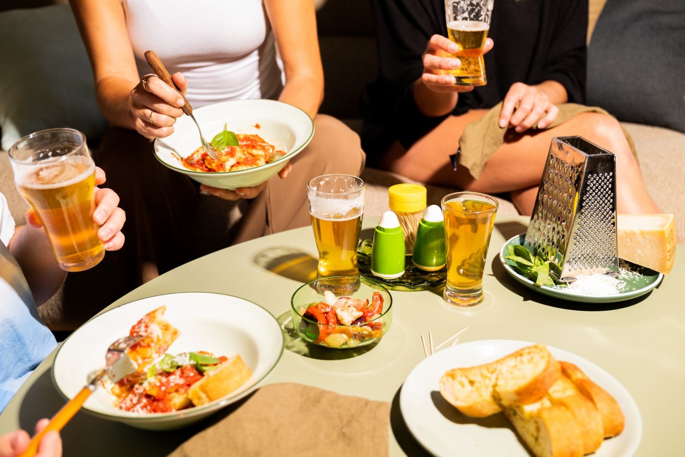 People enjoying food with beer