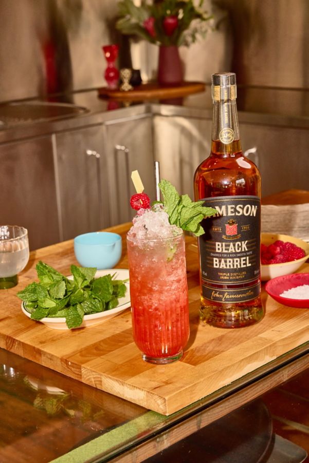 A Young Liars cocktail with a bottle of Jameson Black Barrel