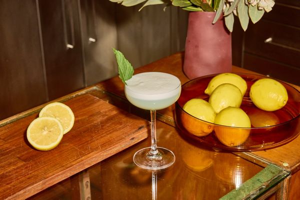 A glass of Brendan Pang's Blushed Lychee Sour