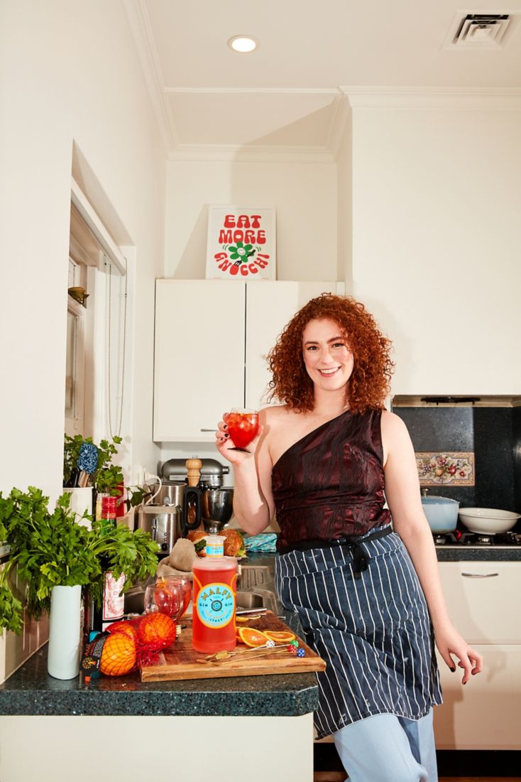 Sophie in her kitchen drinking a Negroni Spritz