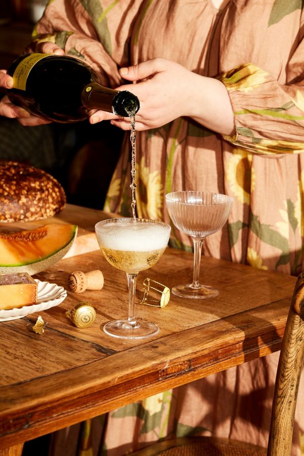 Julia pouring glass of champagne