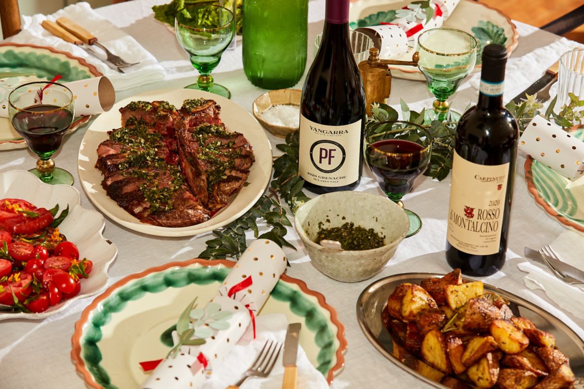 Christmas dining table set up with main and red wines