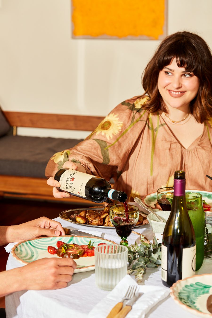 Audrey pulling cheesecake out of the ovem