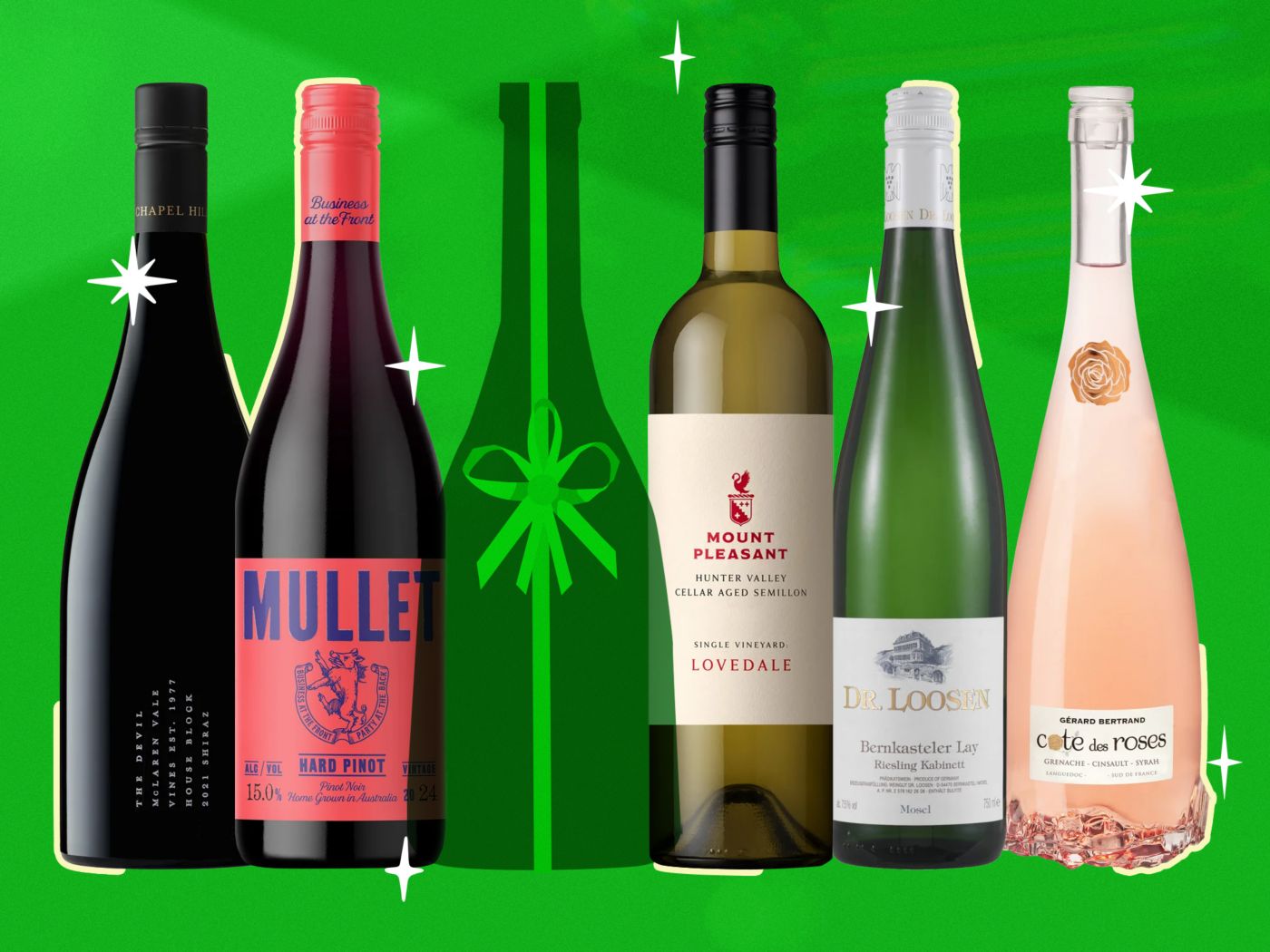 Bottles of wine lined up against a festive green background 