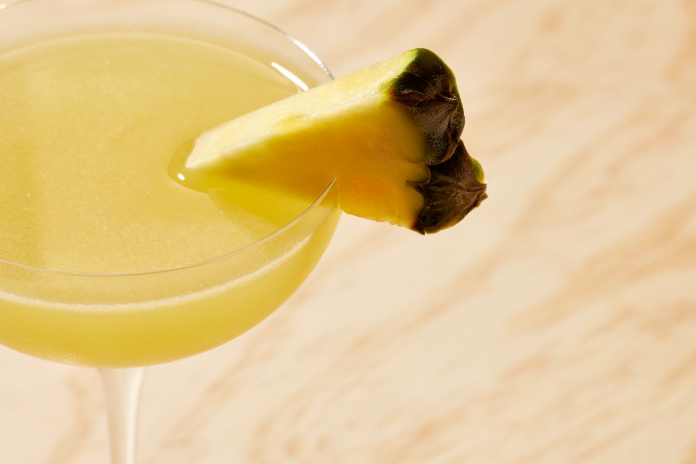 The Pineapple Daiquiri, with a wedge of pineapple as garnish