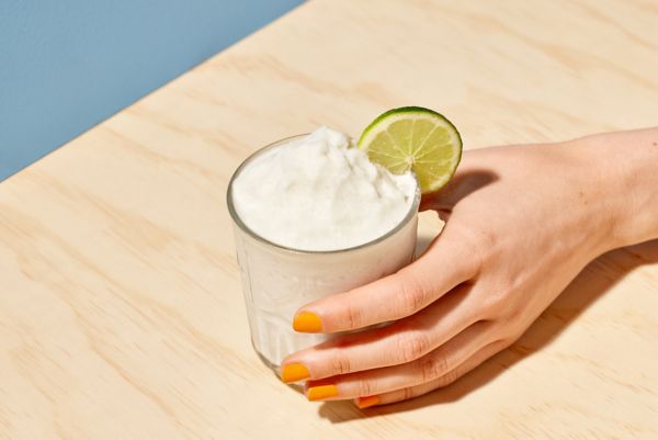 Holding a Frozen Coconut Daiquiri
