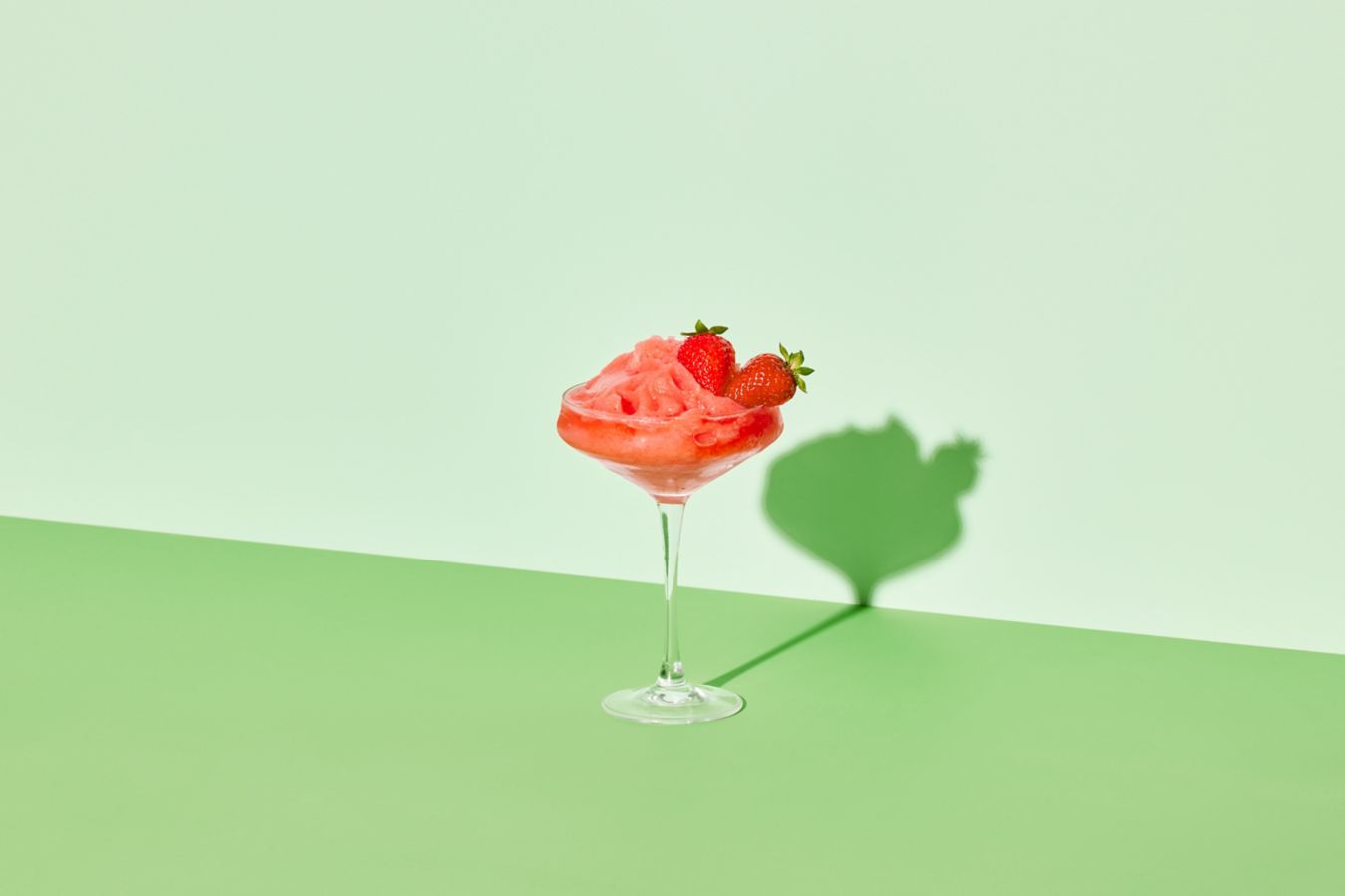 The Frozen Non-Alcoholic Strawberry Daiquiri is garnished with strawberries