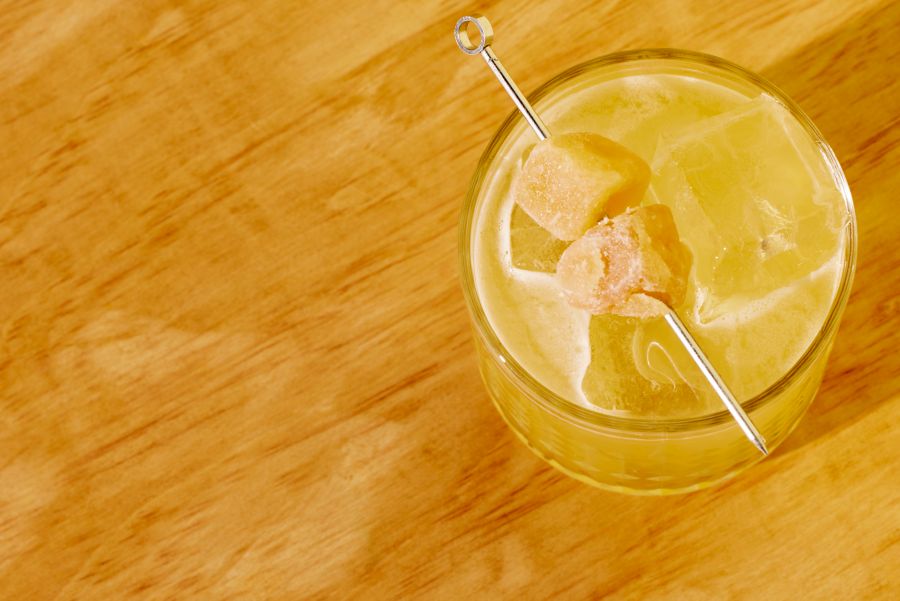 The Penicillin cocktail, garnished with skewered crystallised ginger