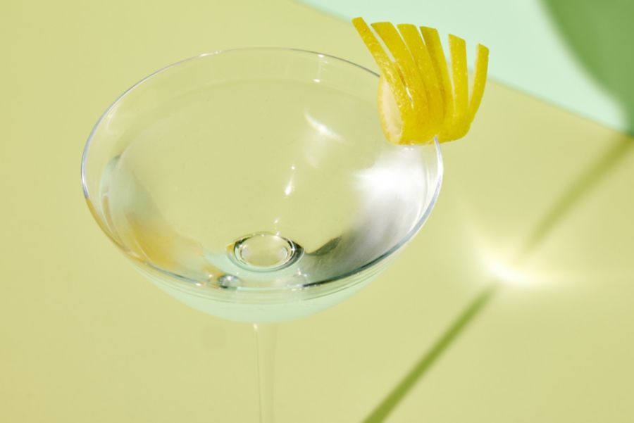 The Vesper cocktail with a lemon peel as garnish 