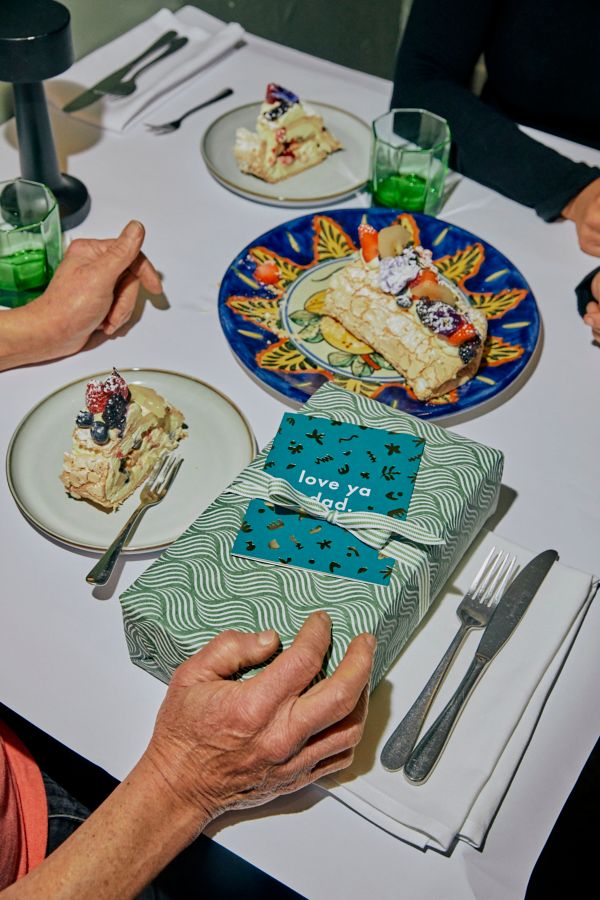A Father's Day present on a table of delicious food