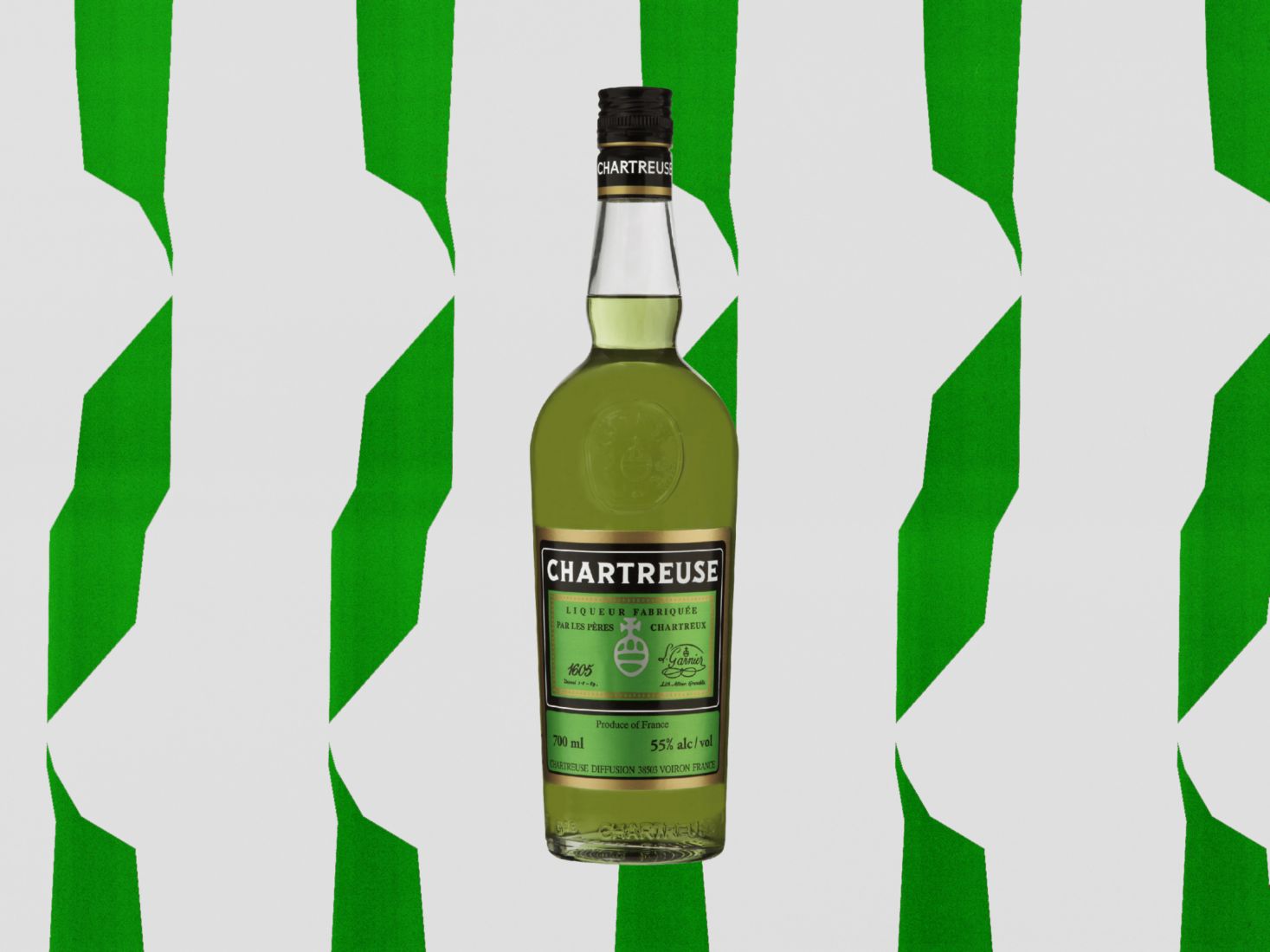 A bottle of Chartreuse against a green and white background