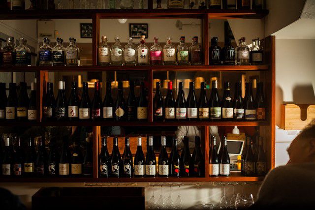 The line-up of wine bottles behind the bar at Bar Two in Launceston