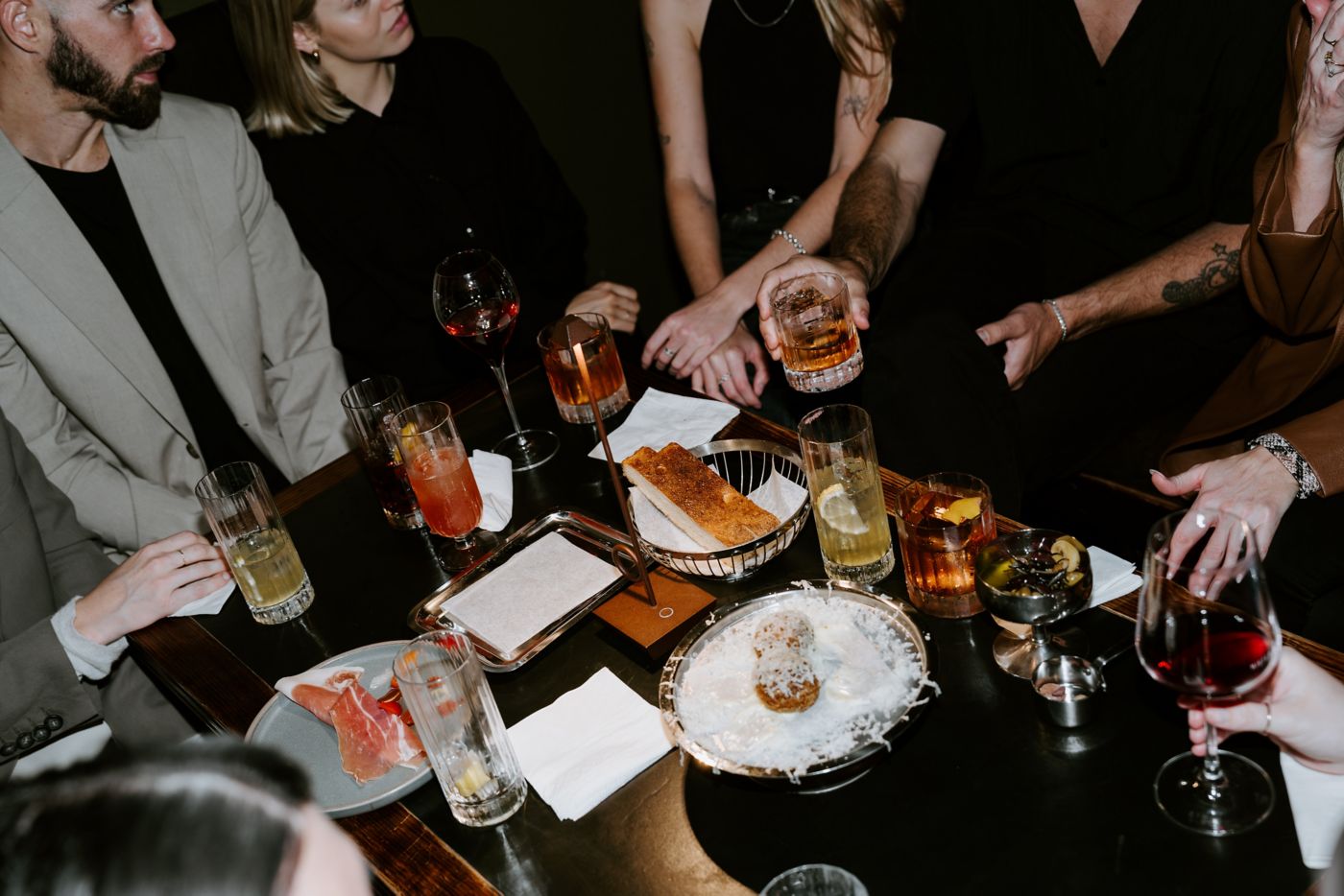 A spread of dishes and drinks at Bianchetto, Melbourne