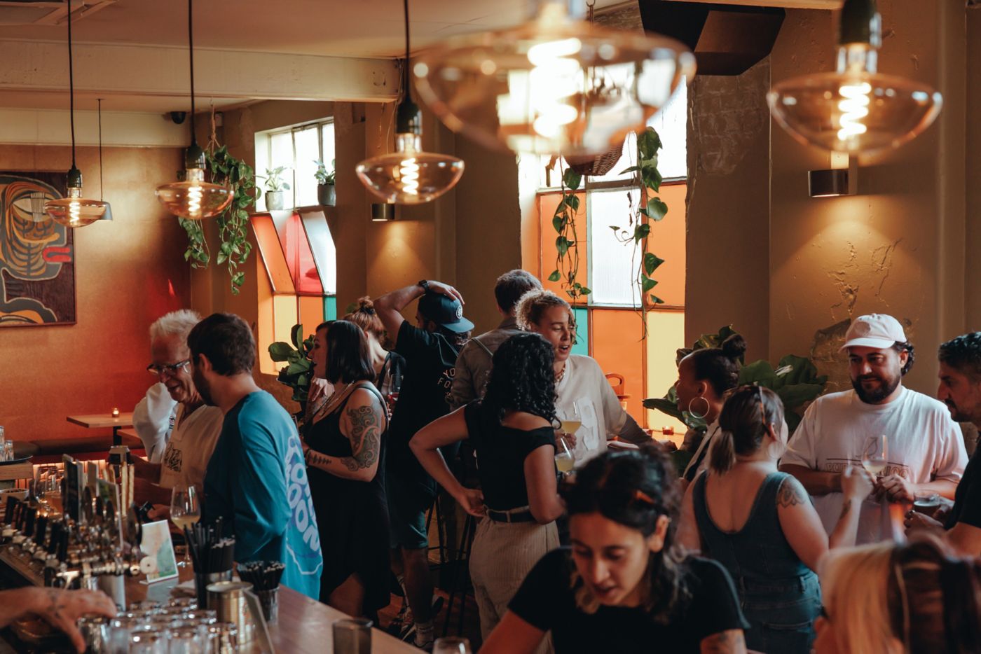 People enjoying drinks at Misfits in Melbourne
