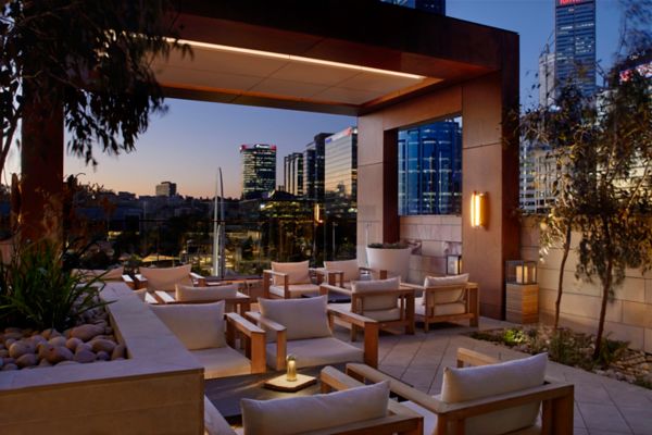  Drink in the high life at the Ritz-Carlton’s rooftop lounge bar, where guests come for the panoramas, refined service and signature cocktails brightened with native flavours. 
