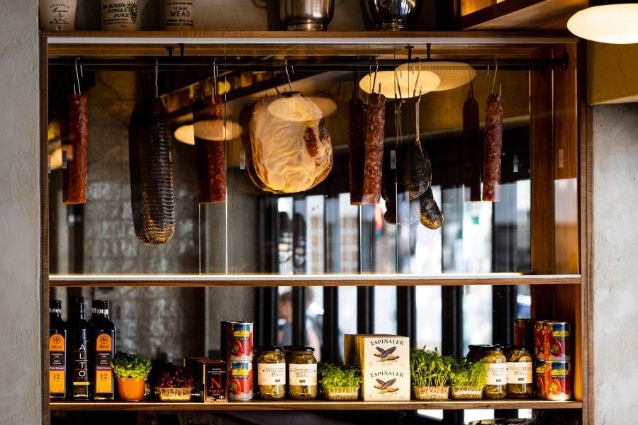 Cured meats hanging at Bar Sopra in Sydney