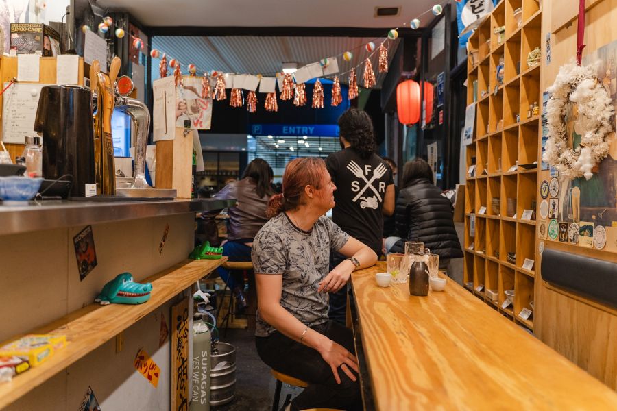 man sitting on chair at Tachinomi