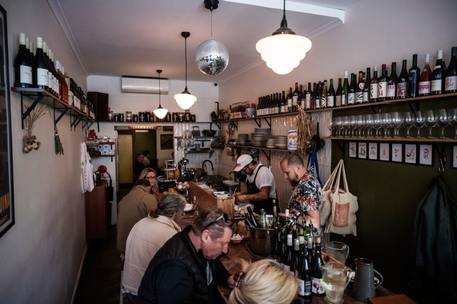 Patrons at the counter in Hey Rosey, Orange