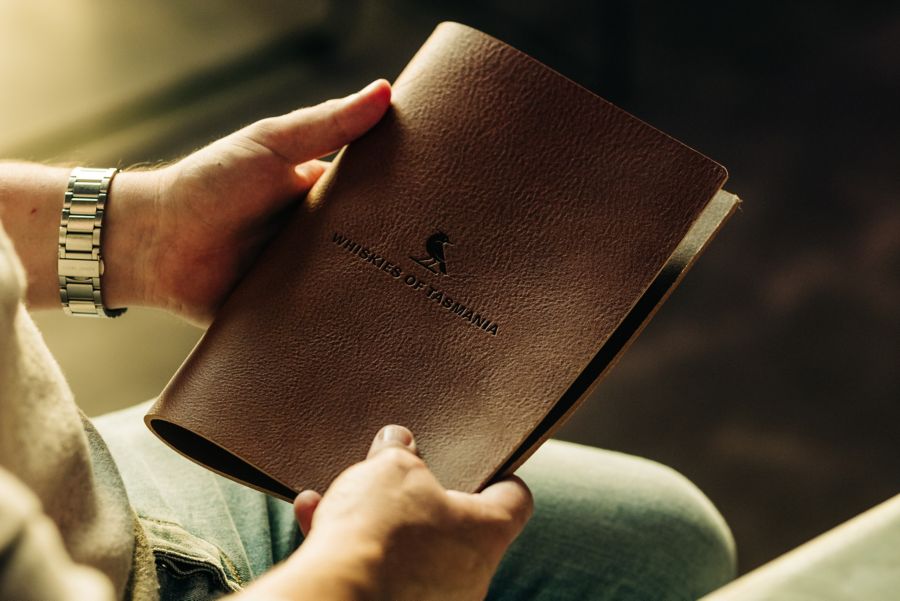 The leather-bound drinks menu at The Still in Hobart 