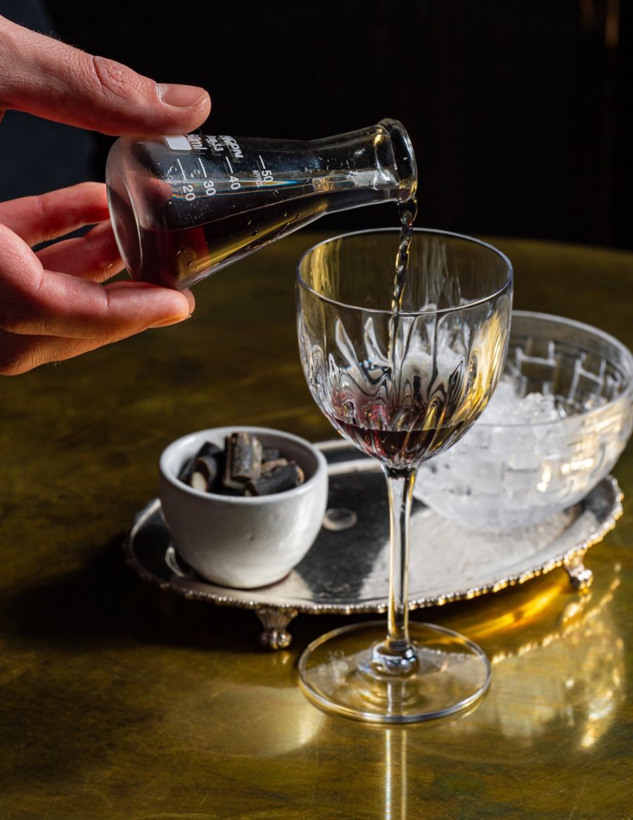 Pouring a glass of wine at Bentley in Sydney