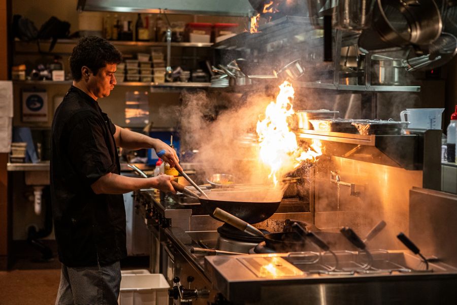 A chef in action at Casa Chow in Brisbane