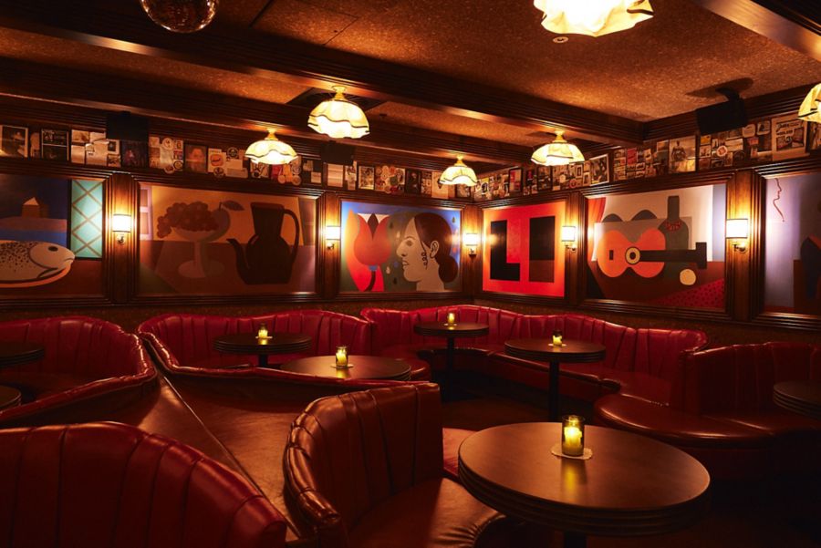 Red banquettes and art inside Sydney's Caterpillar Club