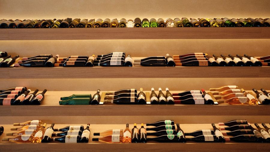 Choose from shelves of wine at Atelier Wine Bar   