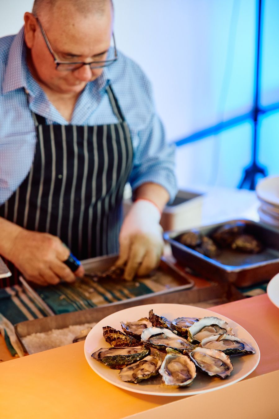 Shucking oysters at Silver Sands in Aldinga Beach, SA