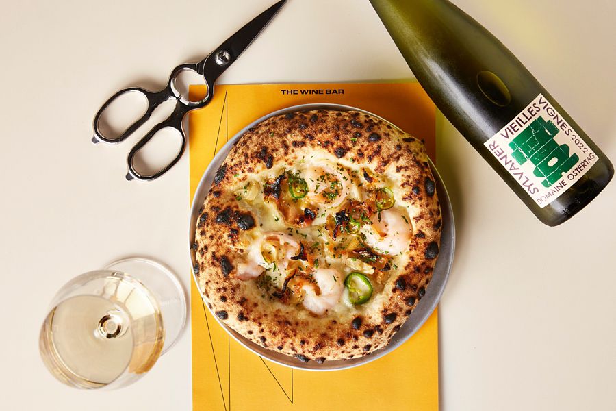 Pizza and wine served at The International 