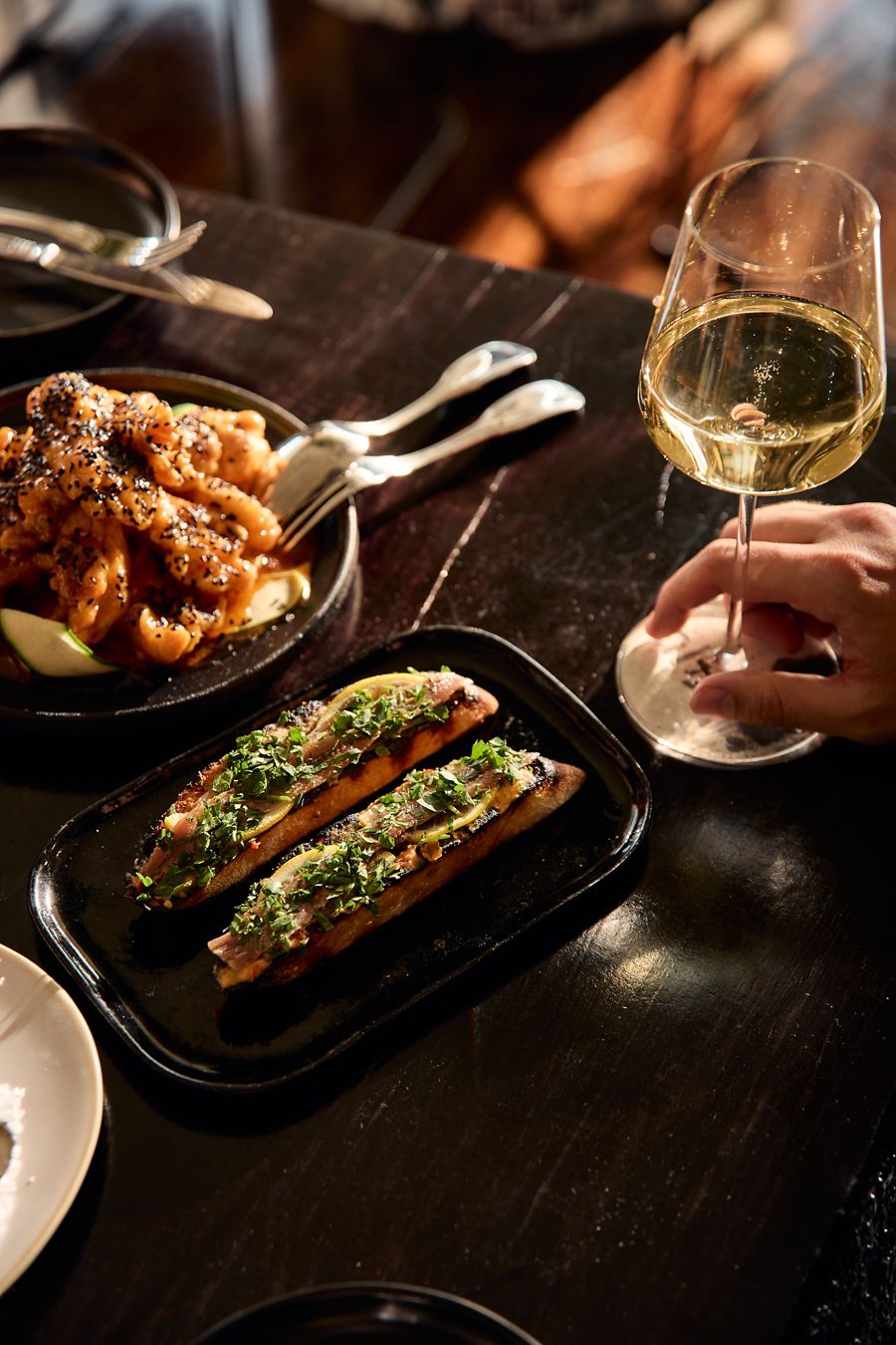 Anchovy toast is a must-order at Alt Wine Bar