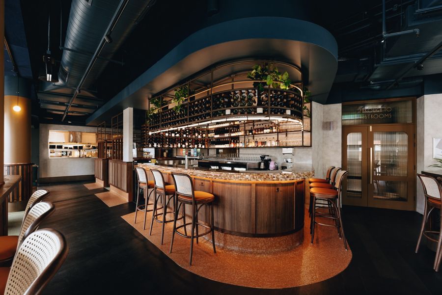 The feature horsehoe bar at the Central Club Hotel