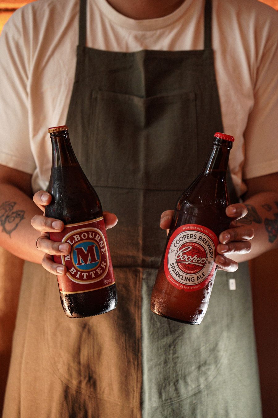 Holding a couple of Coopers longnecks at Bear's Wine Bar 