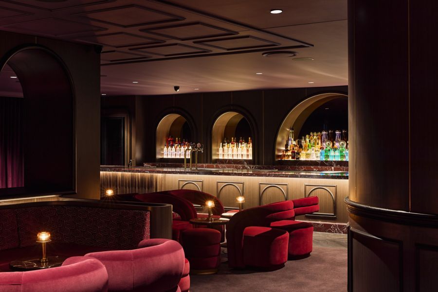 Plush red seating on one of the levels of The Bristol in Sydney  