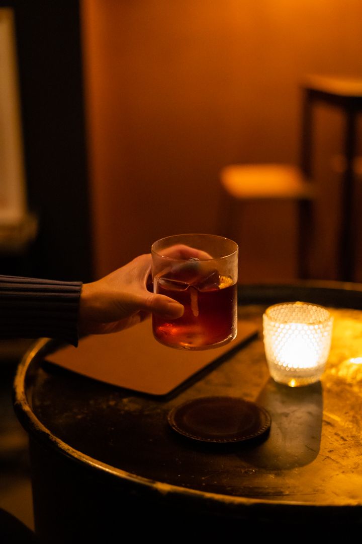 Holding a Negroni
