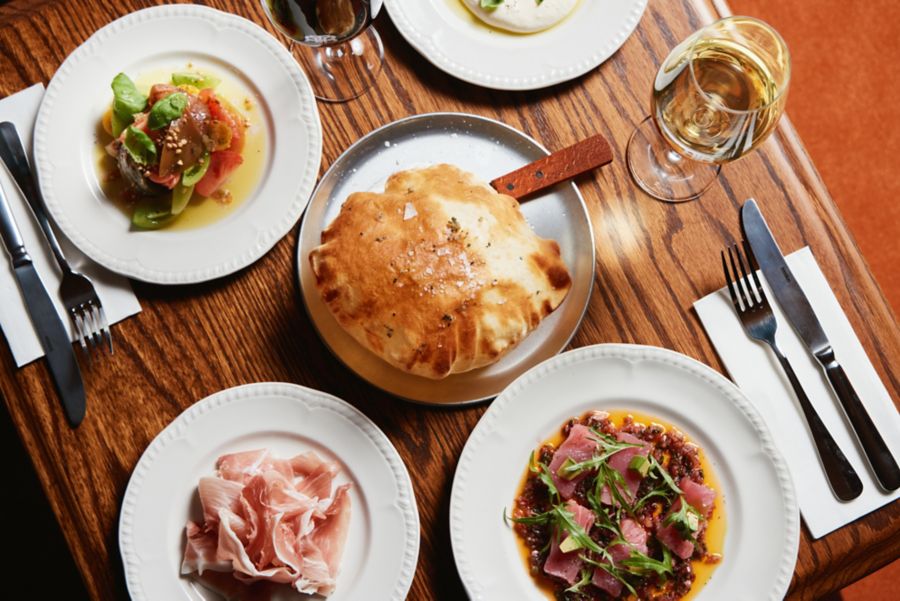 A table full of dishes and drinks at The Beehive Hotel