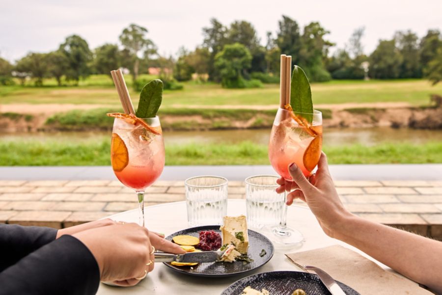 A table enjoying Spritzes and a cheese plate at Coquun
